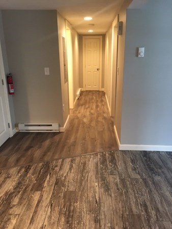 4 Providence Road Sutton, MA 01590 - Photo 8 of 14 a view of a room with wooden floor