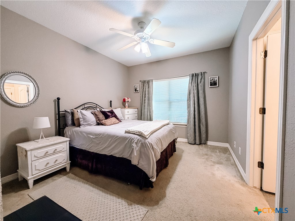 1027 Stagecoach Trail San Marcos, TX 78666 - Photo 19 of 36 a bedroom with a bed and a window