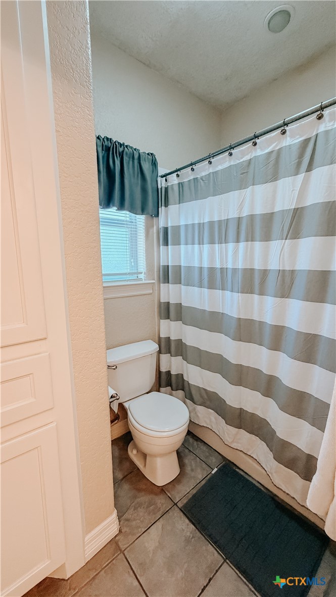 1027 Stagecoach Trail San Marcos, TX 78666 - Photo 20 of 36 a bathroom with a sink and a toilet