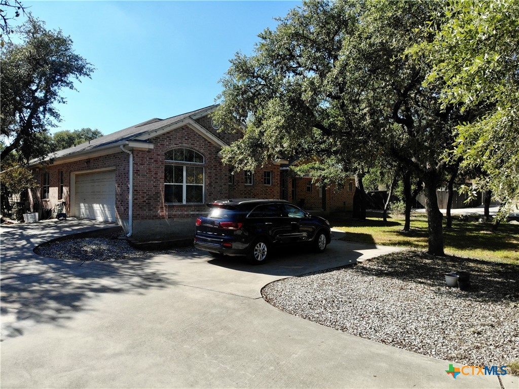 1027 Stagecoach Trail San Marcos, TX 78666 - Photo 3 of 36 a view of a car in front of house