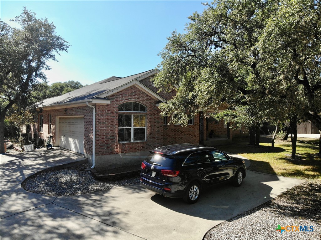 1027 Stagecoach Trail San Marcos, TX 78666 - Photo 32 of 36 a view of a car parked in front of a house