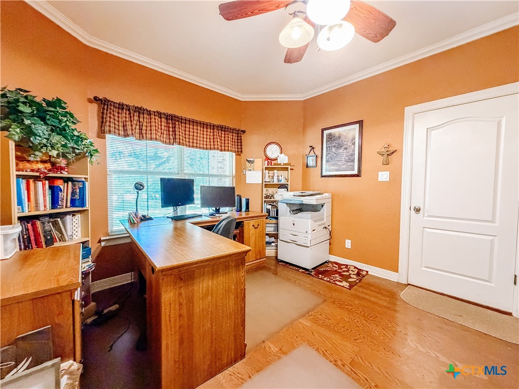 1027 Stagecoach Trail San Marcos, TX 78666 - Photo 7 of 36 a room with furniture a bookshelf and a window
