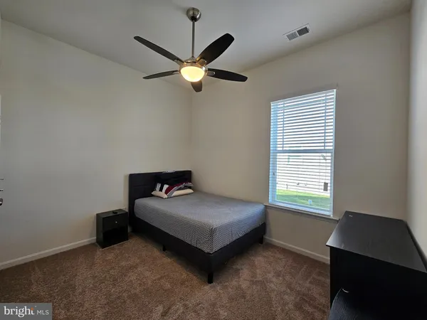 a room with a bed and a window