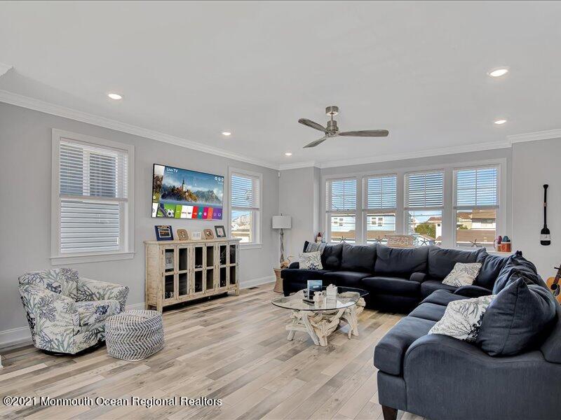 401 8th Avenue Seaside Heights, NJ 08751 - Photo 10 of 45 a living room with furniture and a flat screen tv