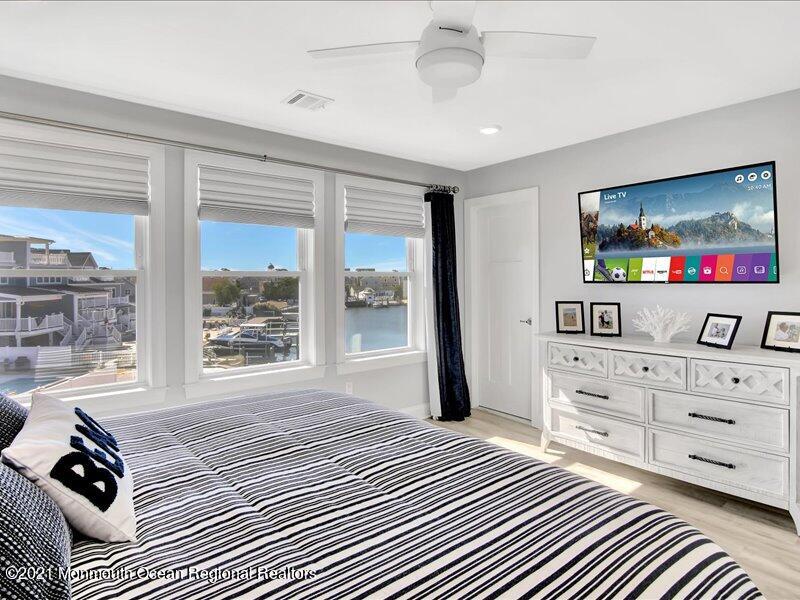 401 8th Avenue Seaside Heights, NJ 08751 - Photo 12 of 45 a bedroom with a bed and a flat screen tv