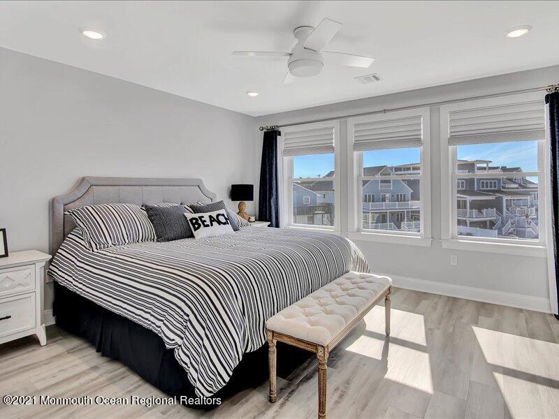 401 8th Avenue Seaside Heights, NJ 08751 - Photo 14 of 45 a bedroom with a bed and a large window