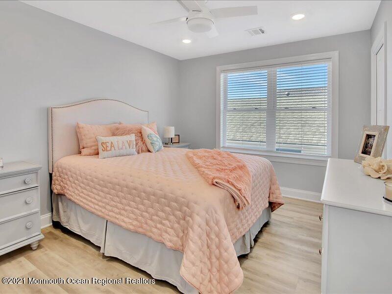 401 8th Avenue Seaside Heights, NJ 08751 - Photo 16 of 45 a bedroom with a bed and window