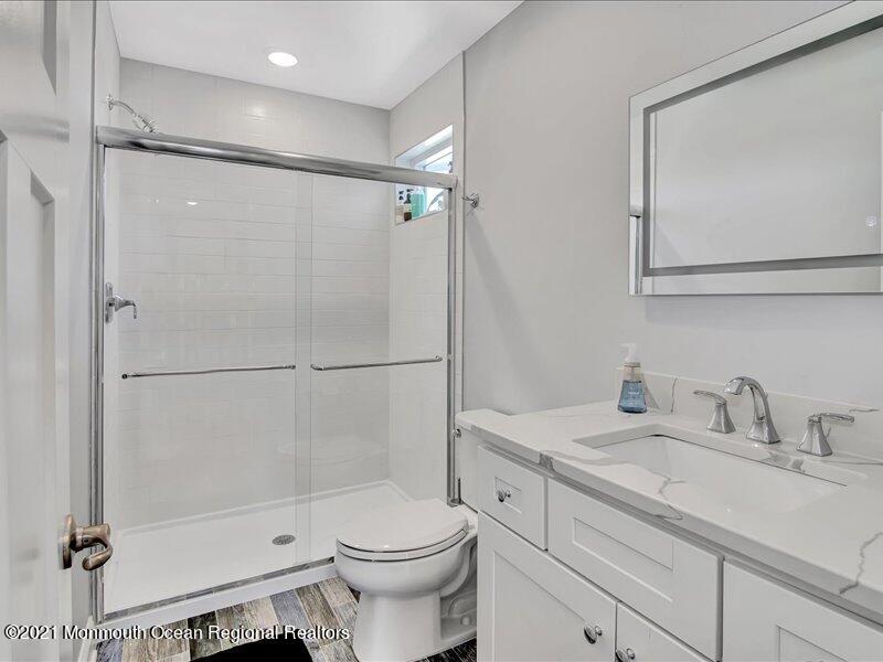 401 8th Avenue Seaside Heights, NJ 08751 - Photo 17 of 45 a bathroom with a sink toilet and shower