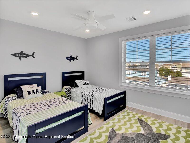 401 8th Avenue Seaside Heights, NJ 08751 - Photo 18 of 45 a bedroom with two beds and a window