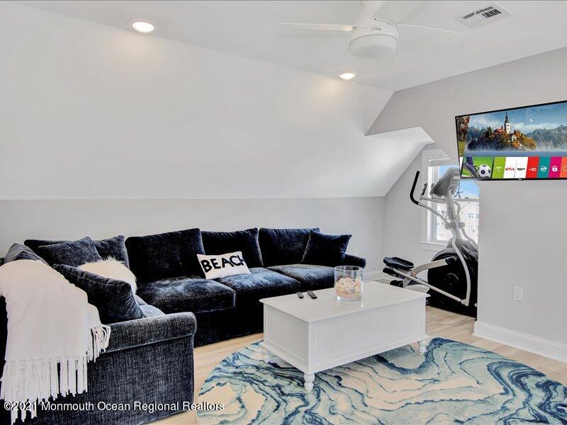 401 8th Avenue Seaside Heights, NJ 08751 - Photo 19 of 45 a living room with furniture and a flat screen tv
