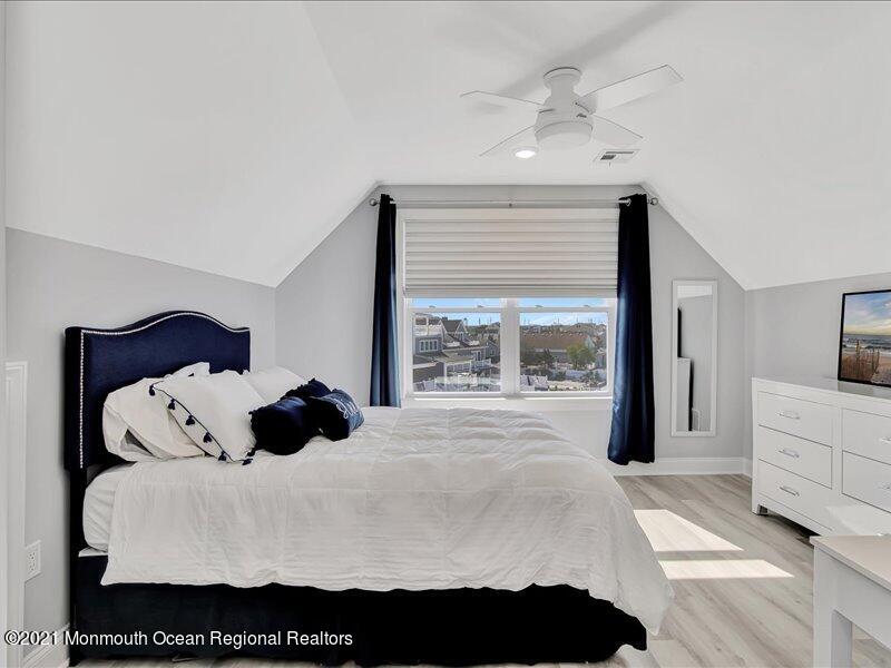 401 8th Avenue Seaside Heights, NJ 08751 - Photo 20 of 45 a large white bed in a white room