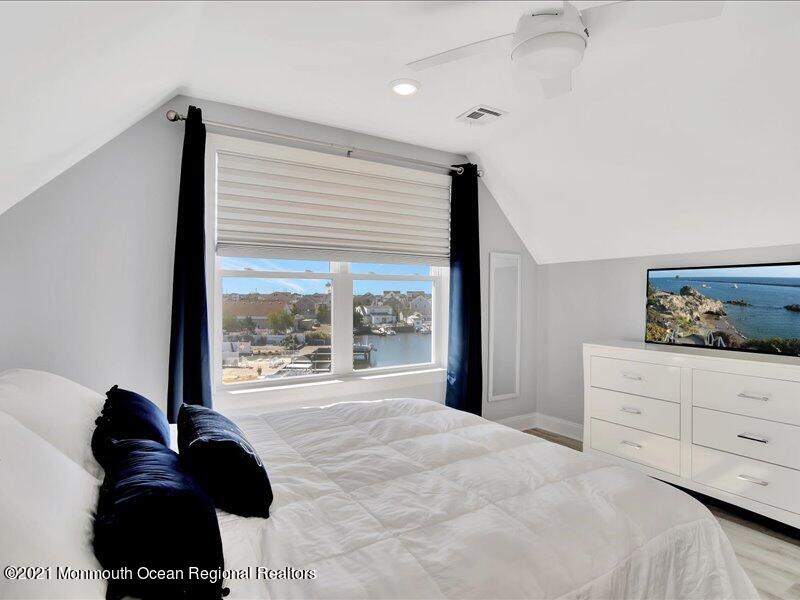 401 8th Avenue Seaside Heights, NJ 08751 - Photo 23 of 45 a bedroom with a large bed and a large window