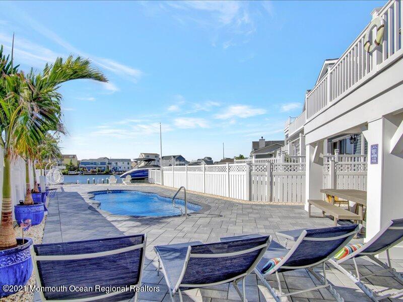 401 8th Avenue Seaside Heights, NJ 08751 - Photo 25 of 45 a swimming pool with outdoor seating and yard