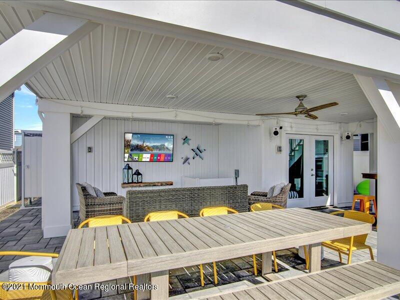 401 8th Avenue Seaside Heights, NJ 08751 - Photo 26 of 45 a living room with a table tennis pool table and chairs