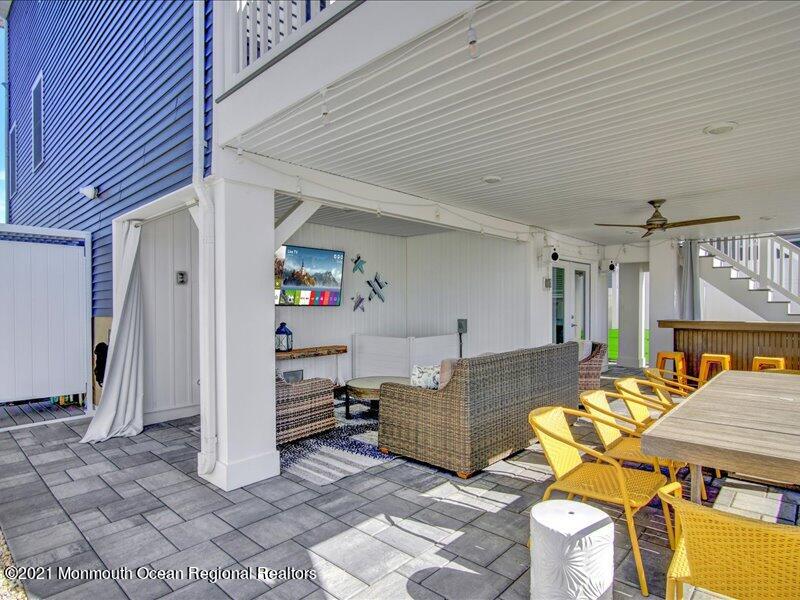 401 8th Avenue Seaside Heights, NJ 08751 - Photo 28 of 45 a living room with furniture and a table