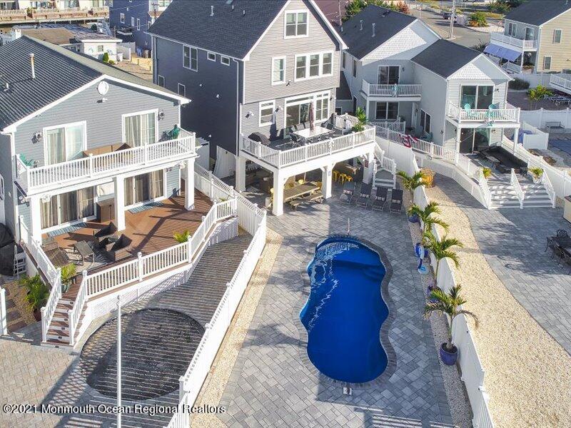 401 8th Avenue Seaside Heights, NJ 08751 - Photo 4 of 45 a aerial view of a house with a swimming pool and chairs