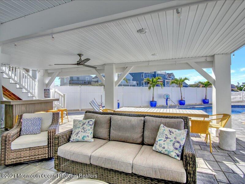 401 8th Avenue Seaside Heights, NJ 08751 - Photo 32 of 45 a living room with furniture and a table