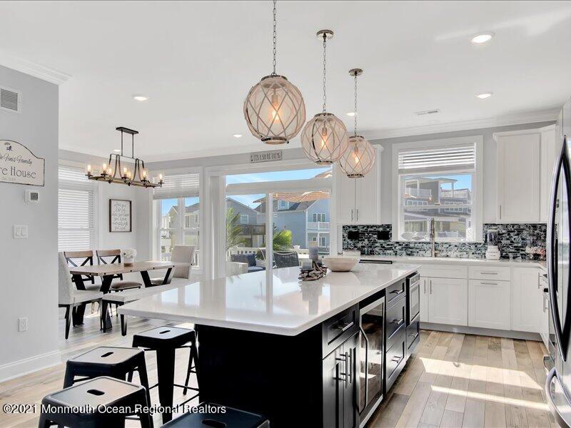 401 8th Avenue Seaside Heights, NJ 08751 - Photo 7 of 45 a kitchen with sink cabinets and living room view
