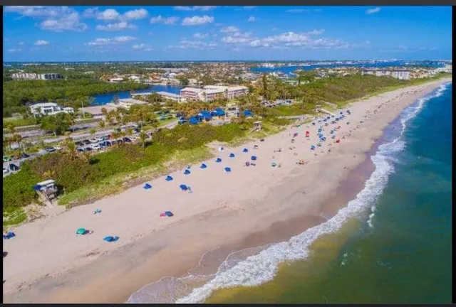 a front view of a building with a lot of windows