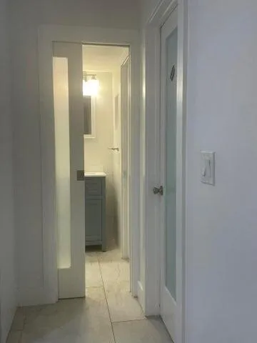 a bathroom with a sink and mirror