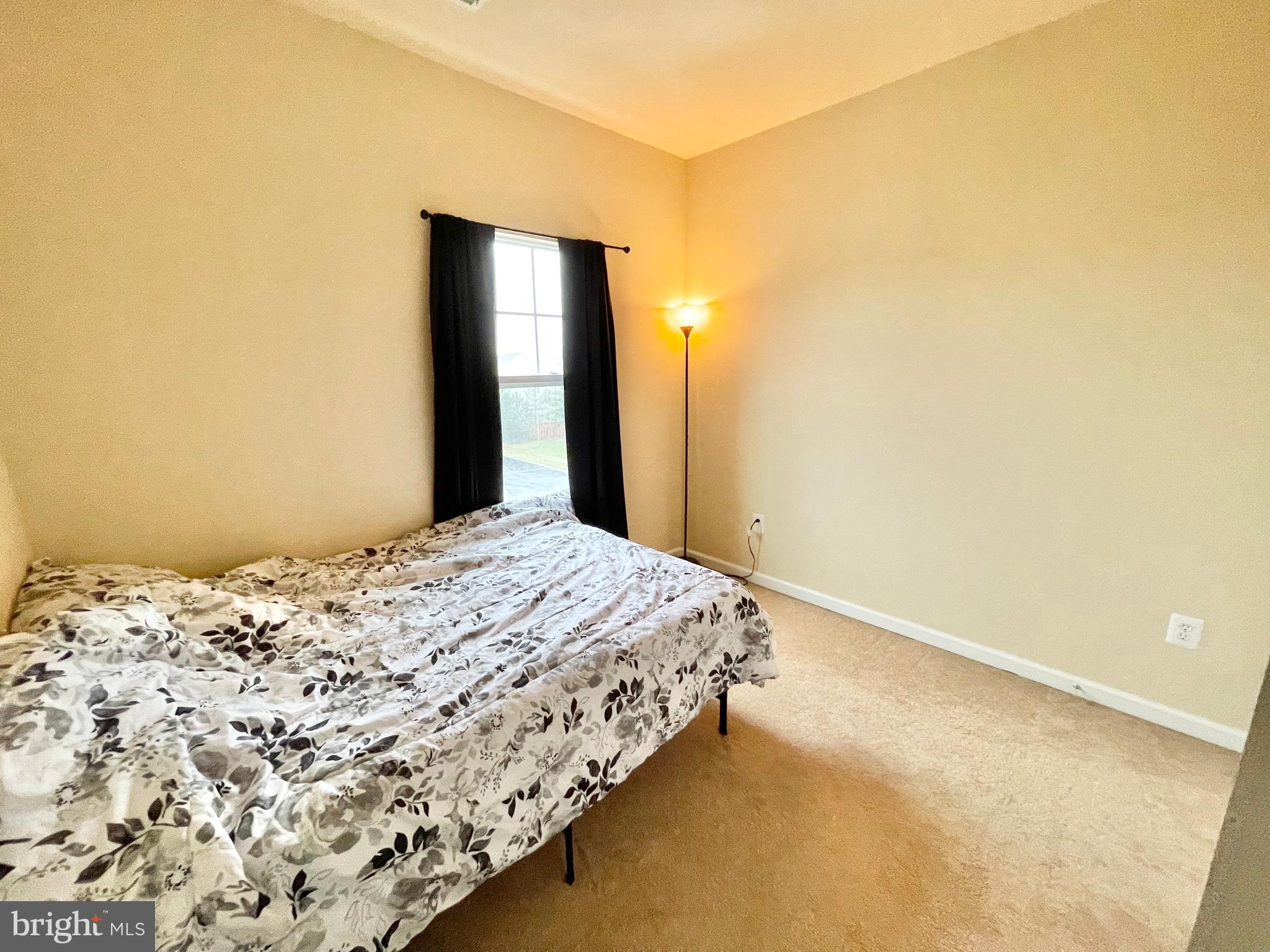 155 Short Branch Road Stafford, VA 22556 - Photo 24 of 32 a bedroom with a bed