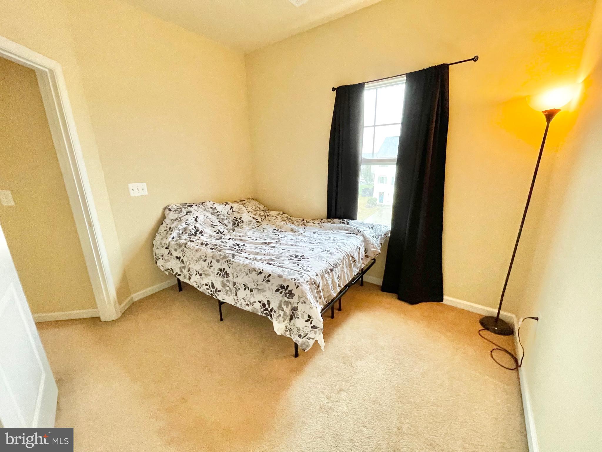 155 Short Branch Road Stafford, VA 22556 - Photo 25 of 32 a bed sitting in a bedroom next to a window