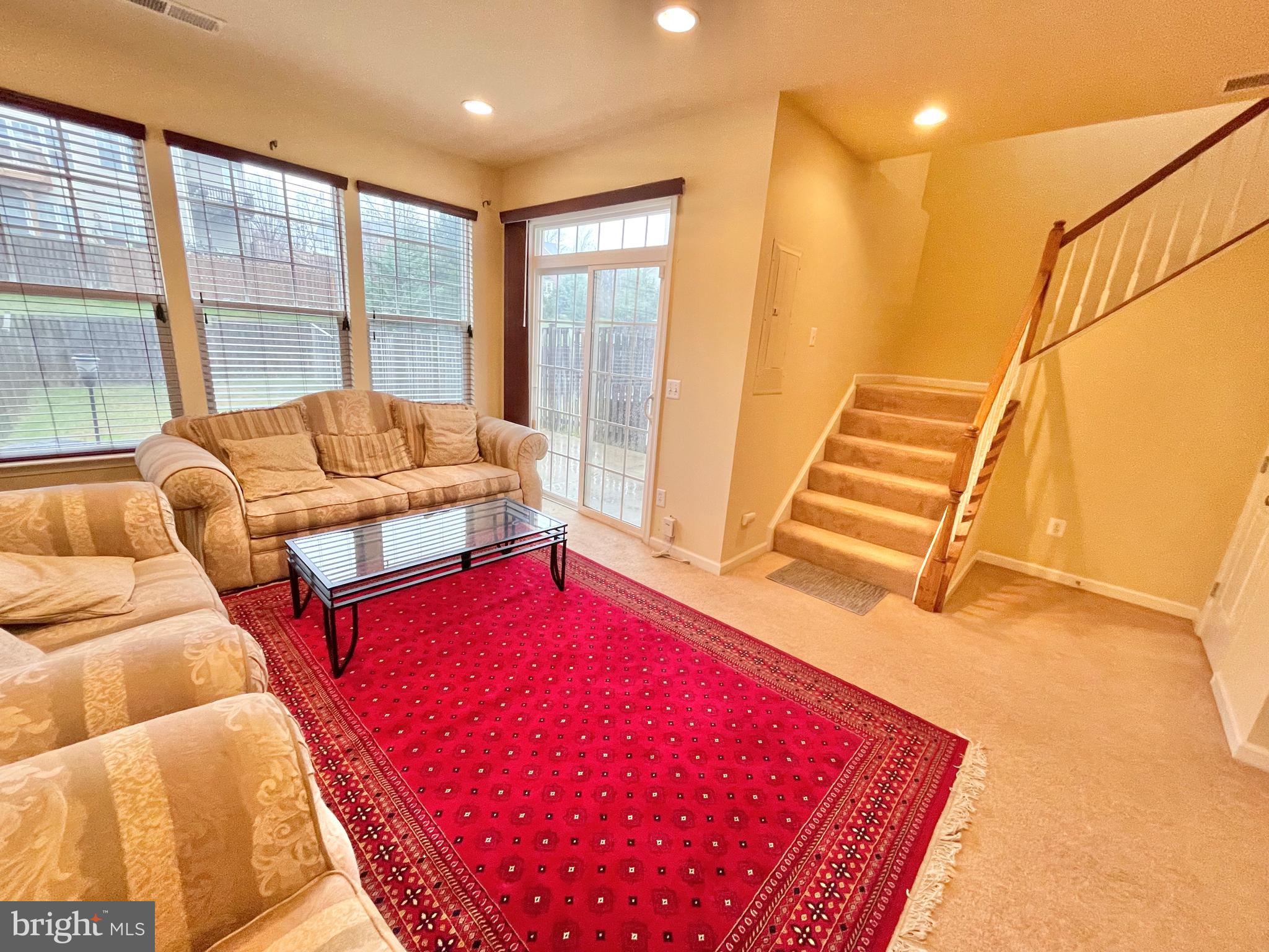 155 Short Branch Road Stafford, VA 22556 - Photo 27 of 32 a living room with a rug table and a fireplace