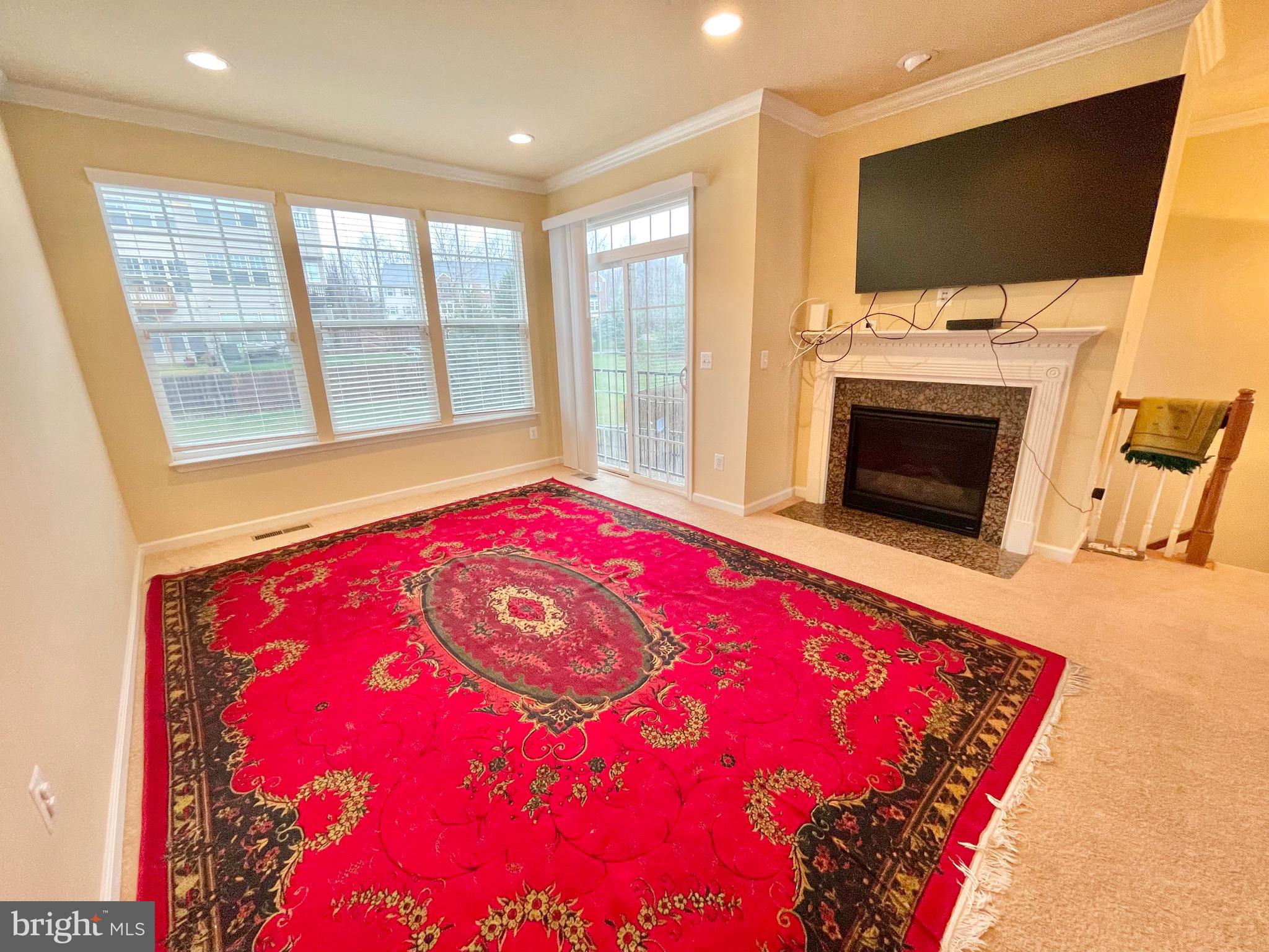 155 Short Branch Road Stafford, VA 22556 - Photo 3 of 32 a living room with a fireplace and a flat screen tv