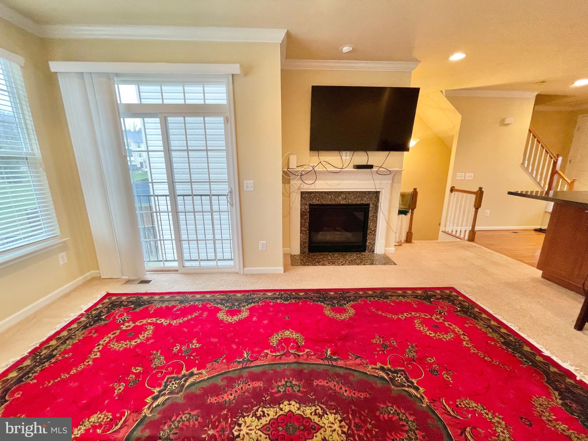 155 Short Branch Road Stafford, VA 22556 - Photo 4 of 32 a living room with a bed and a flat screen tv
