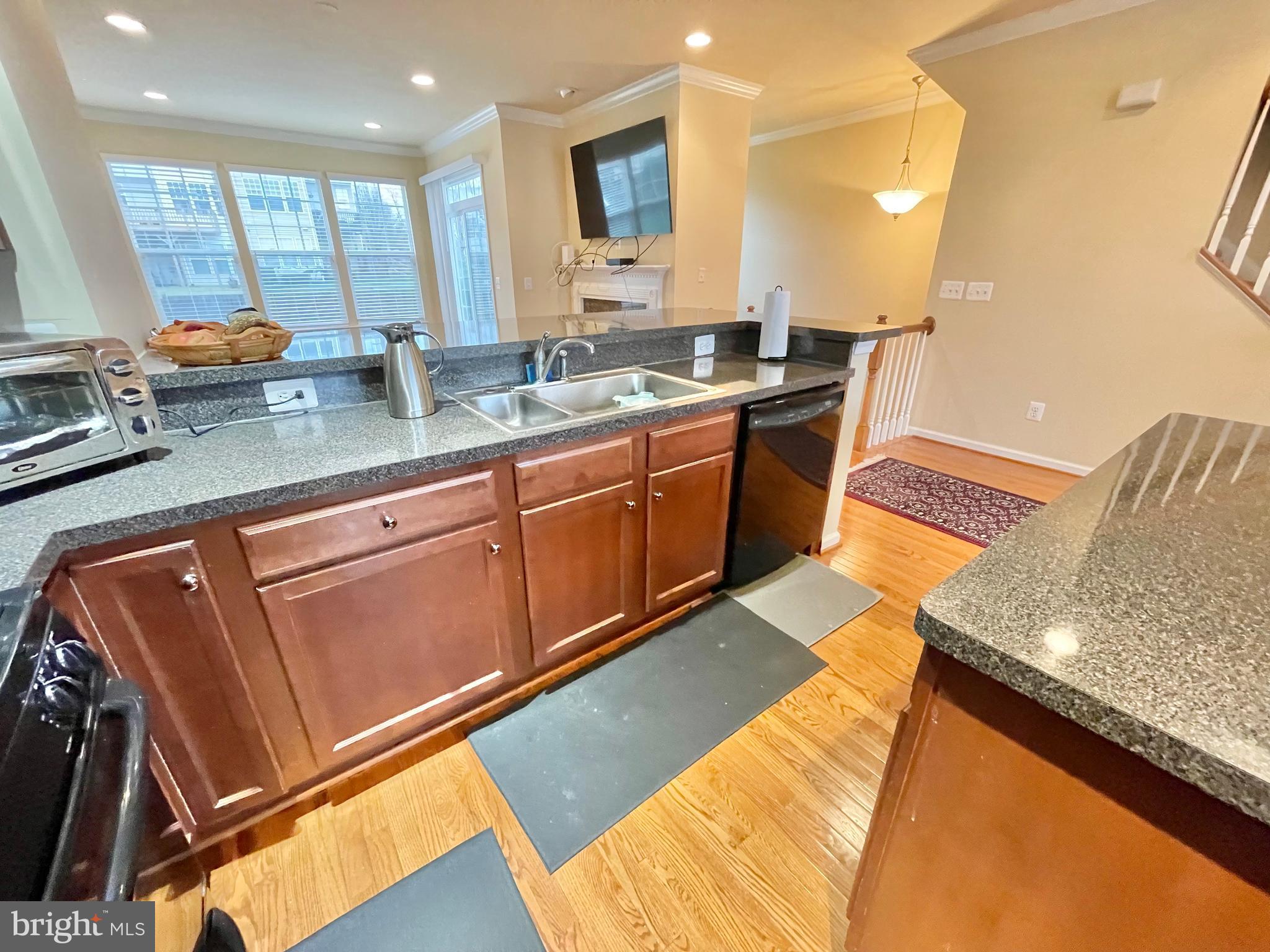 155 Short Branch Road Stafford, VA 22556 - Photo 10 of 32 a kitchen with stainless steel appliances granite countertop a sink stove and cabinets