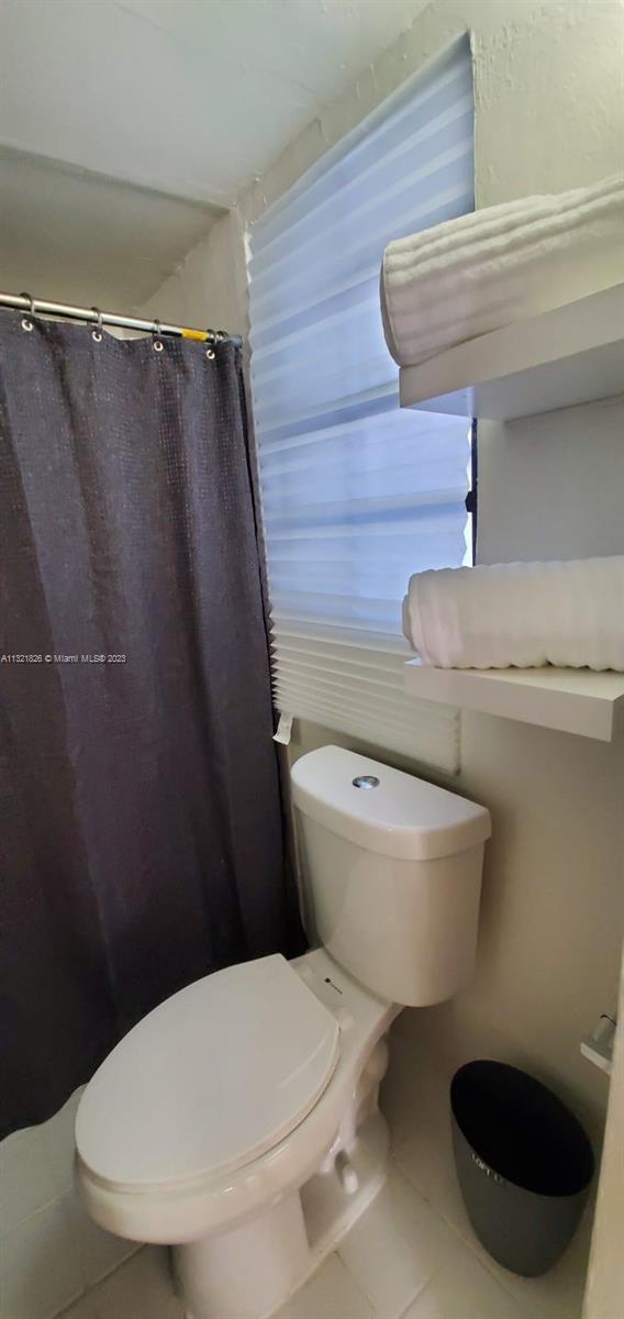 275 Northwest 46th Street, Unit B Miami, FL 33127 - Photo 9 of 9 a bathroom with a toilet and a sink