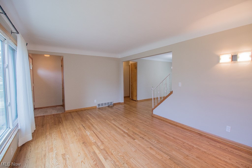 1329 West Miner Road Mayfield Heights, OH 44124 - Photo 4 of 21 Freshly painted Living Room with beautiful hardwood floor.