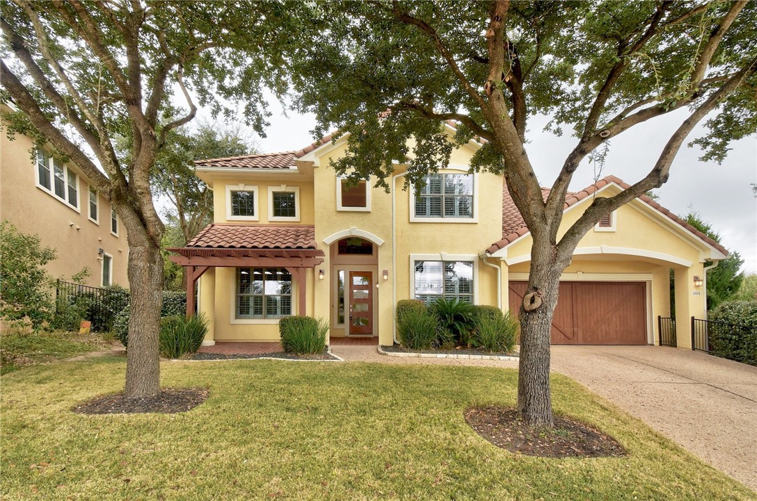 2604 Old Hickory Cove Austin, TX 78732 - Photo 1 of 1 a front view of a house with a yard