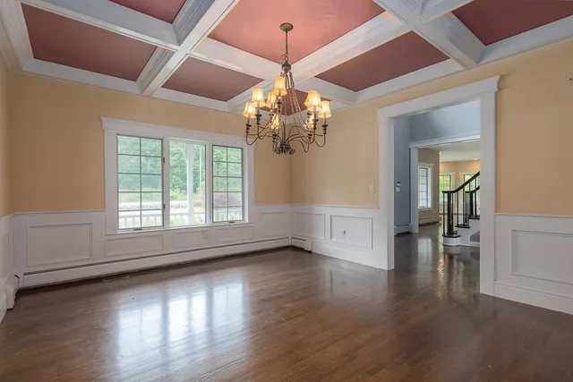 a view of livingroom with wooden floor and chandelier