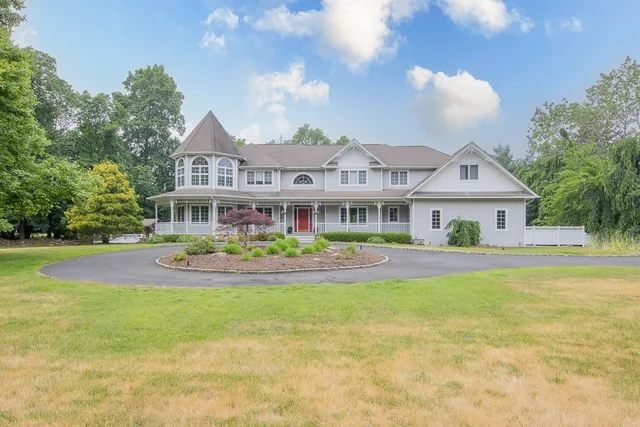 a front view of house with yard and outdoor seating