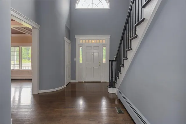 a view of entryway with wooden floor
