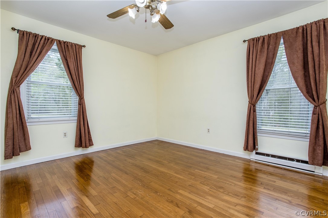 11610 Buckhorn Road Chesterfield, VA 23838 - Photo 17 of 37 a view of an empty room with wooden floor and a window