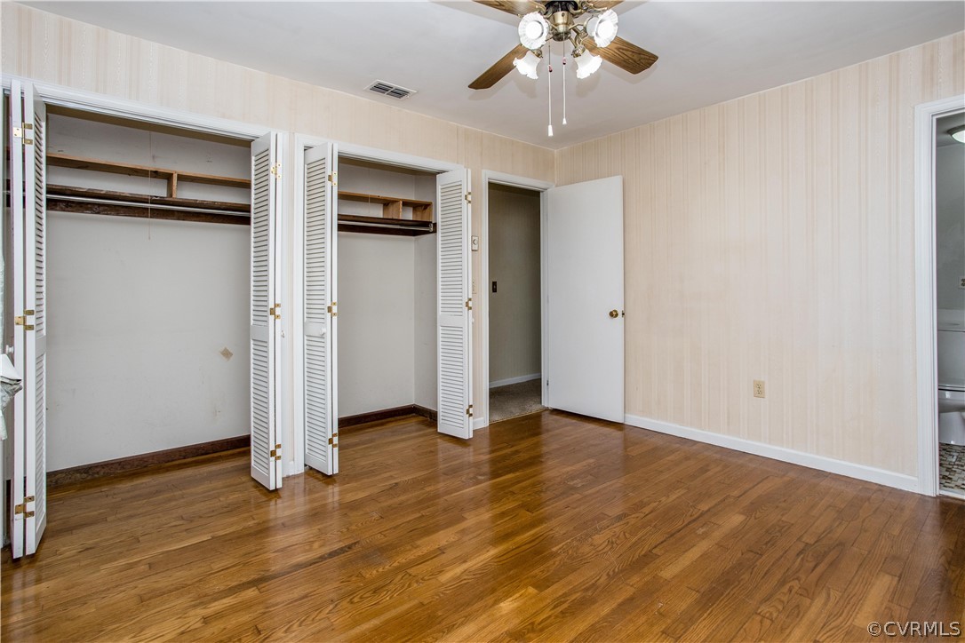 11610 Buckhorn Road Chesterfield, VA 23838 - Photo 19 of 37 an empty room with wooden floor closet and windows