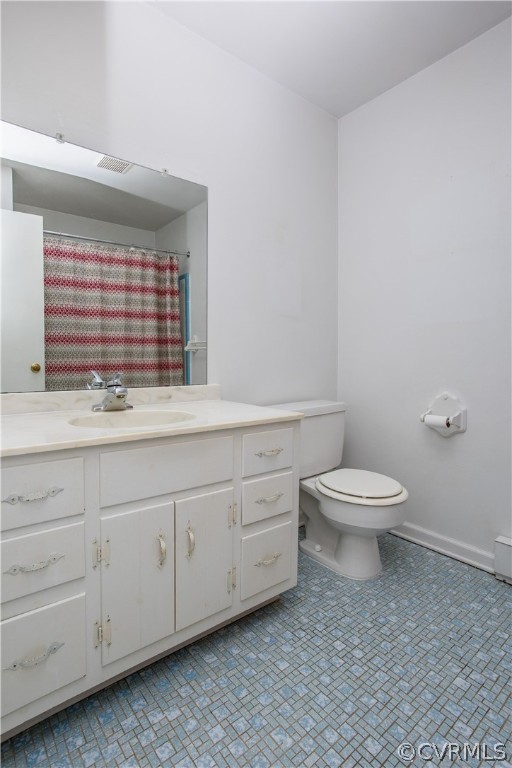 11610 Buckhorn Road Chesterfield, VA 23838 - Photo 23 of 37 a bathroom with a toilet sink and window