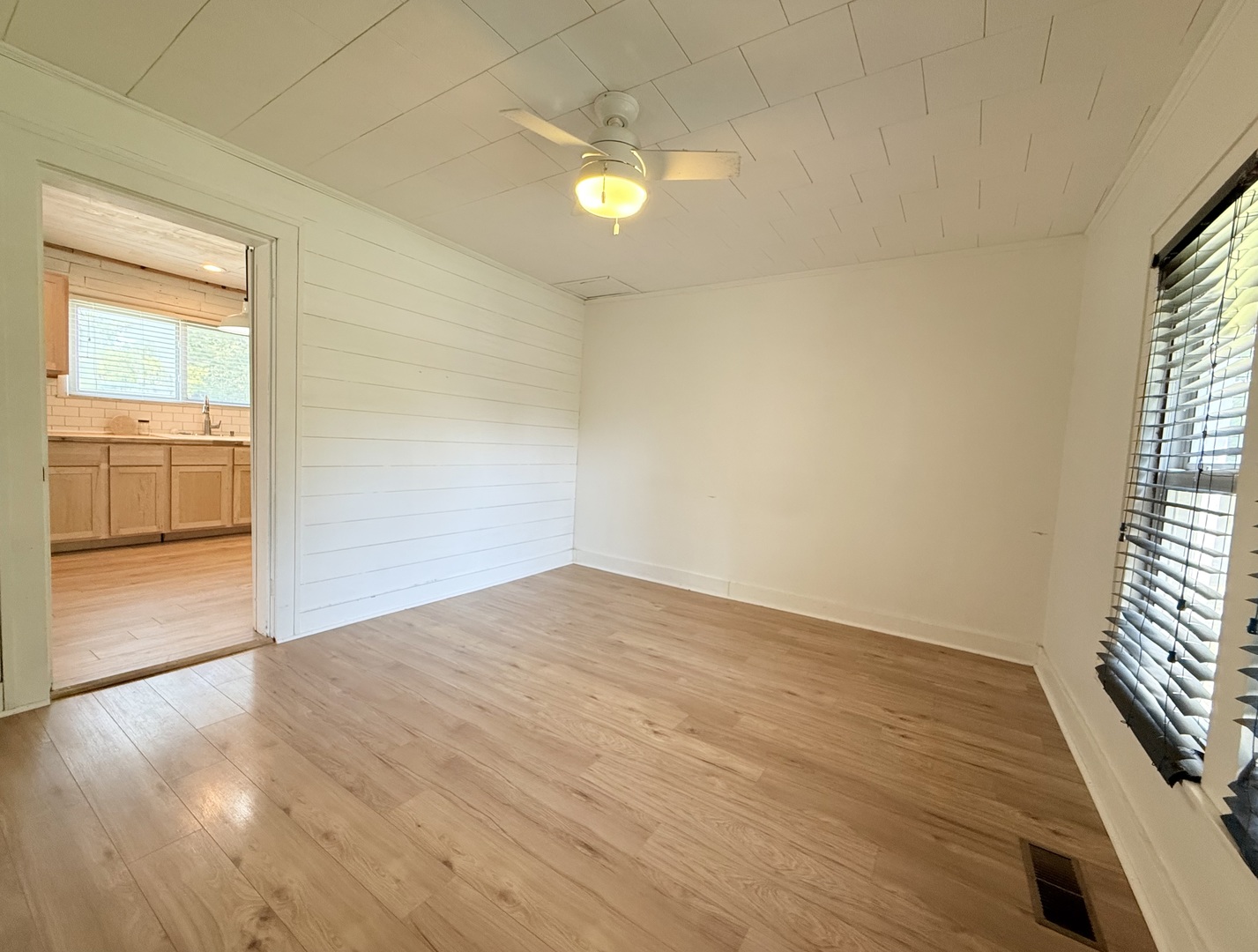 90 Pickering Road Harrisburg, IL 62946 - Photo 11 of 15 wooden floor in an empty room with a window