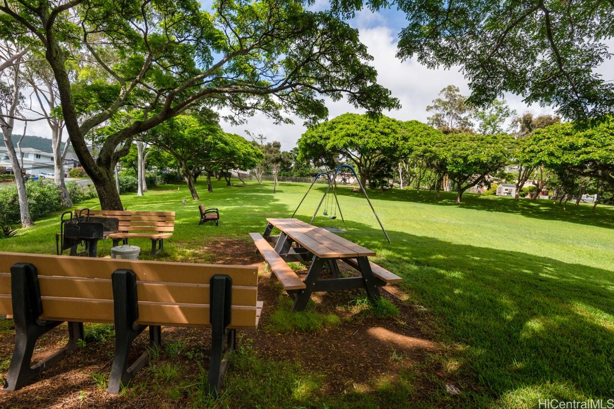 3138 Waialae Avenue, Unit 136 Honolulu, HI 96816 - Photo 14 of 18 a view of a chairs in a backyard