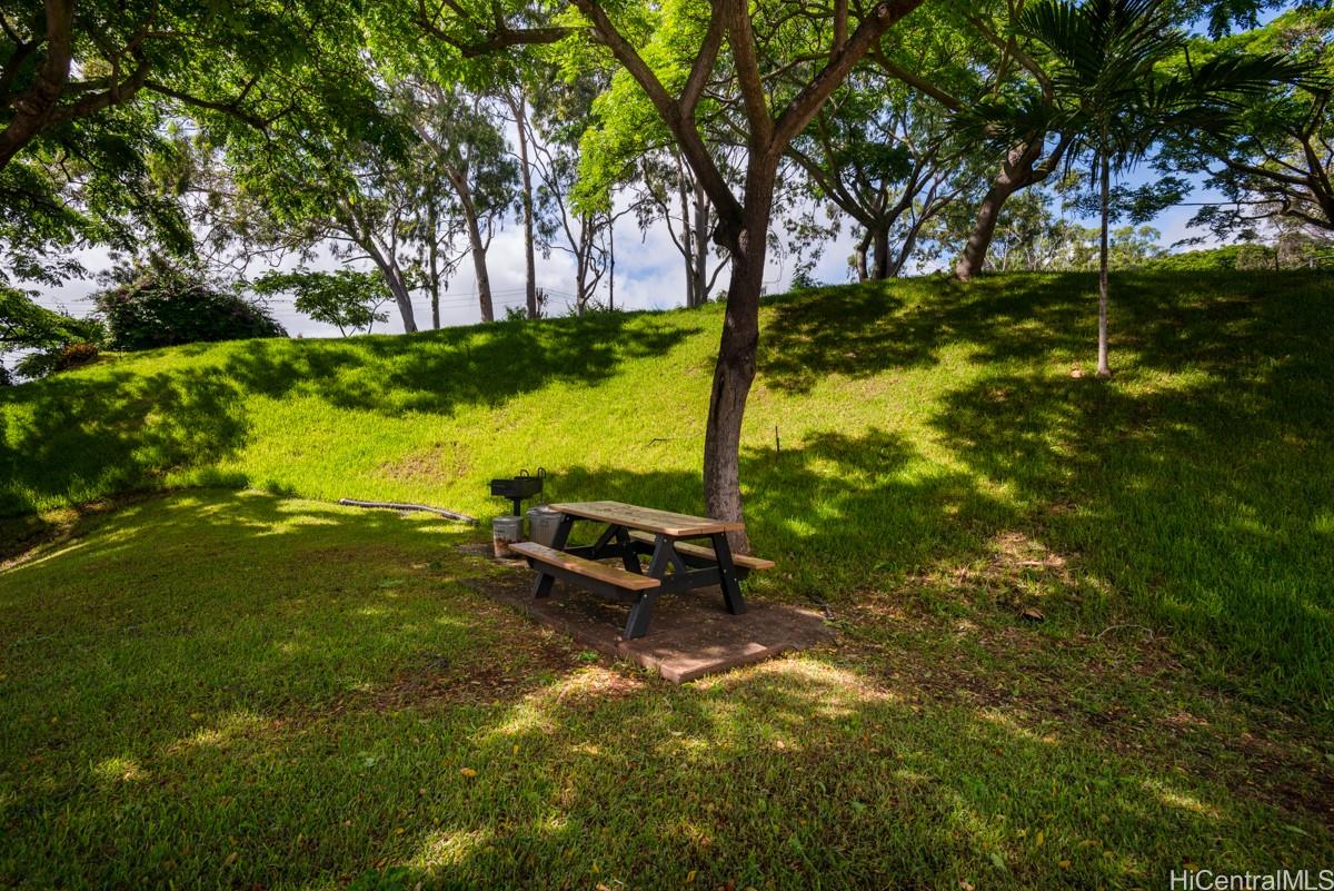 3138 Waialae Avenue, Unit 136 Honolulu, HI 96816 - Photo 15 of 18 a view of a lake with a yard