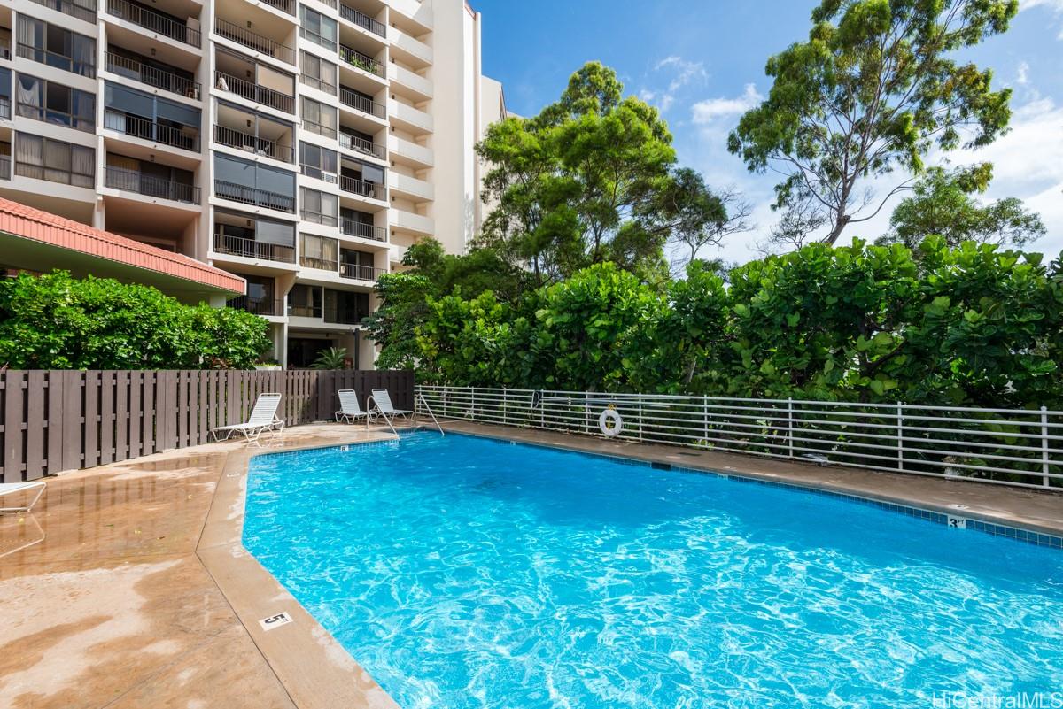 3138 Waialae Avenue, Unit 136 Honolulu, HI 96816 - Photo 17 of 18 a view of a swimming pool with a patio