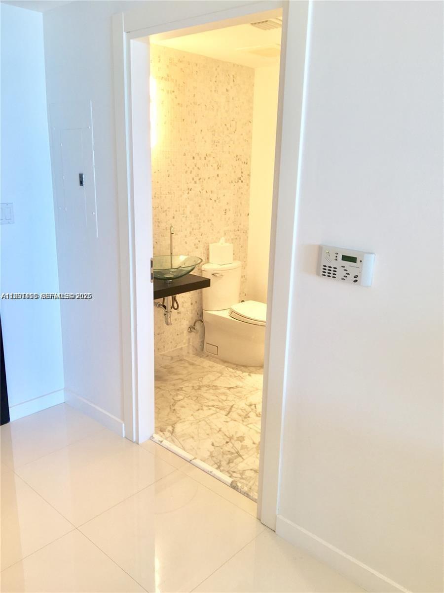 200 Biscayne Blvd Way, Unit 3712 Miami, FL 33131 - Photo 12 of 18 a view of bathroom from a window