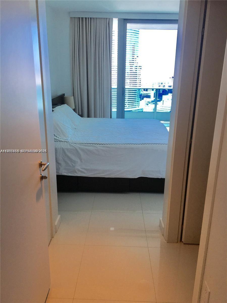 200 Biscayne Blvd Way, Unit 3712 Miami, FL 33131 - Photo 13 of 18 a view of bedroom and bathroom