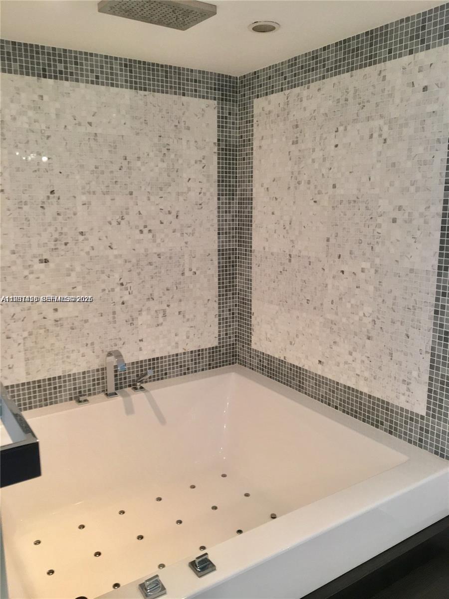 200 Biscayne Blvd Way, Unit 3712 Miami, FL 33131 - Photo 18 of 18 a bathroom with a bathtub and shower