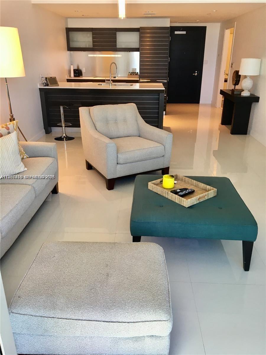 200 Biscayne Blvd Way, Unit 3712 Miami, FL 33131 - Photo 9 of 18 a living room with furniture and wooden floor