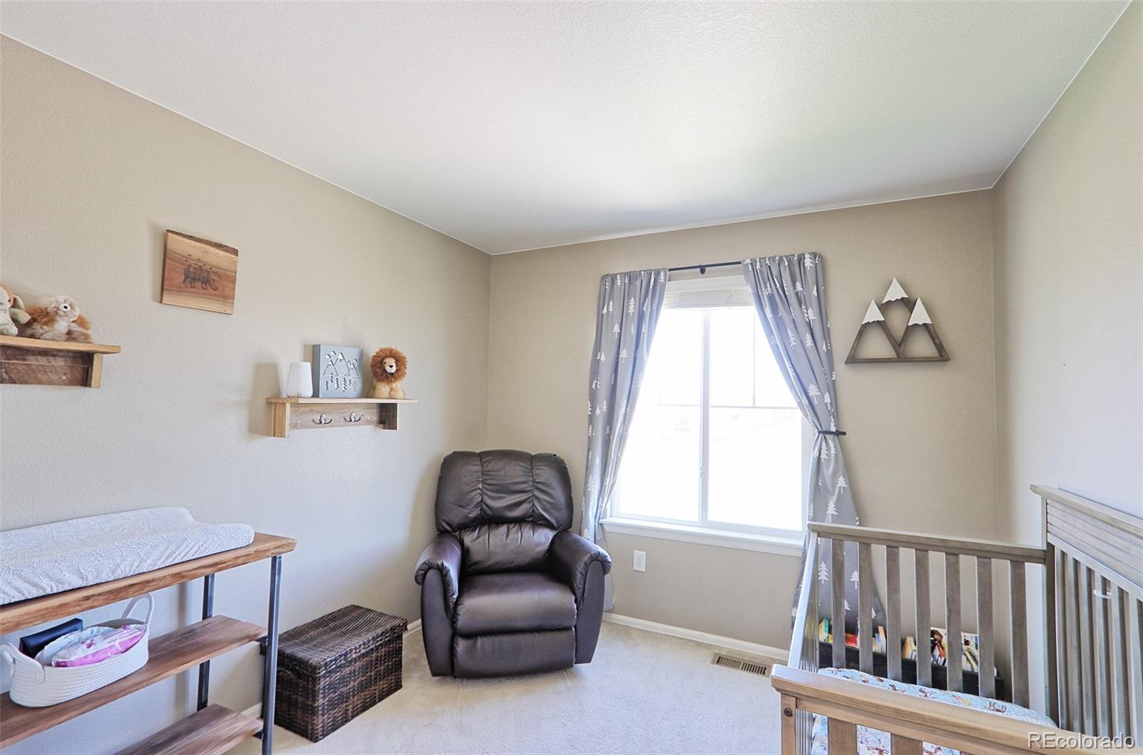 8376 Brandywine Avenue Frederick, CO 80504 - Photo 22 of 31 a living room with furniture and a window