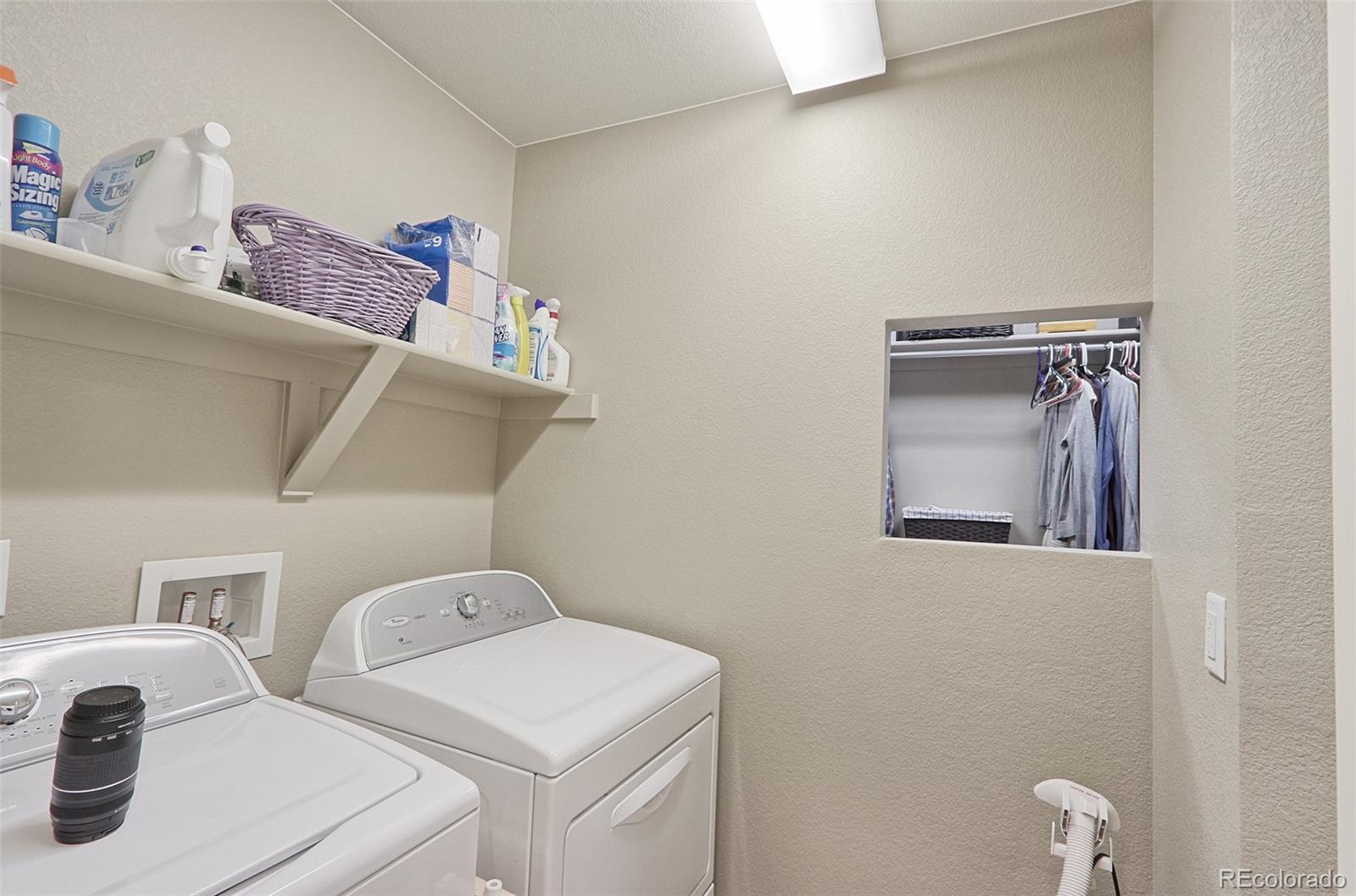 8376 Brandywine Avenue Frederick, CO 80504 - Photo 23 of 31 a utility room with dryer and washer