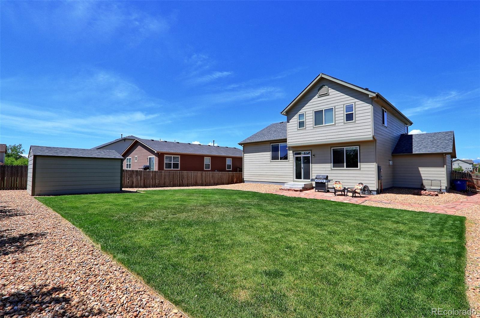 8376 Brandywine Avenue Frederick, CO 80504 - Photo 27 of 31 a front view of a house with yard and porch